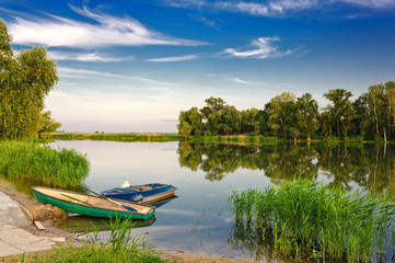 boat on the river. Sunlight Dancing on River: Boat Cruising Through Picturesque Sunset...