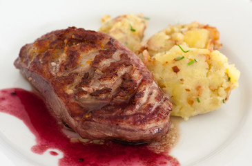 Roasted duck breasts with mashed potatoes in wine sauce