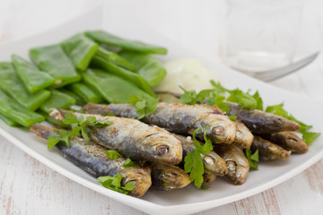fried sardines with boiled green beans and onion