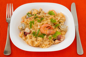 rice with seafood in the white plate