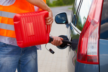 Man pouring fuel