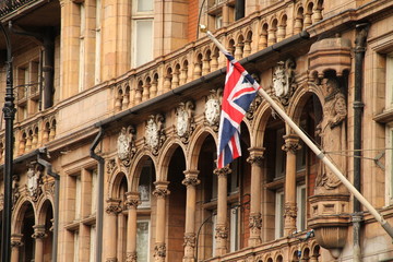 Union Jack flag in the facade of a Victorian building in London