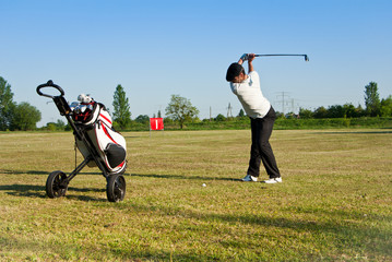golfer on deiving range