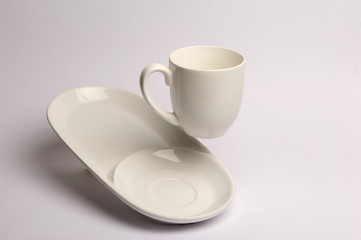 Empty white porcelain coffe Cup with white serving