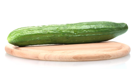 long cucumber on wooden cutting board isolated on white