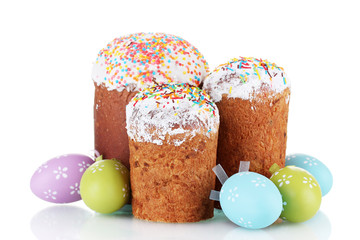 Beautiful Easter cakes and colorful eggs isolated on white
