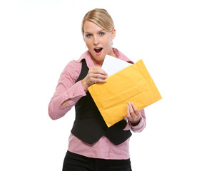 Surprised woman opening letter