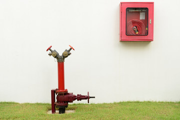 The red fire hydrant and fire hose