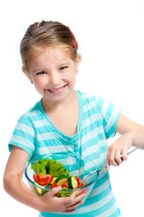 cute little girl with a plate of salad