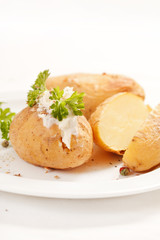 Baked potato filled with soft cheese