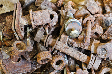 closeup on rusty screws, nuts and bolts