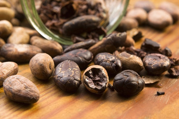 Cocoa (cacao) beans on natural wooden table