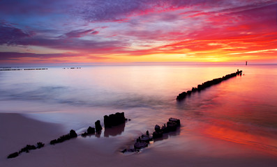 Baltic sea at beautiful sunrise in Poland beach. - obrazy, fototapety, plakaty