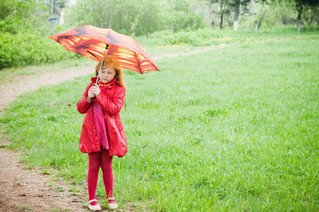 little girl with umbrella outdoor