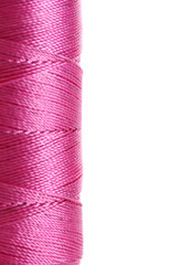 pink bobbin thread isolated on white.