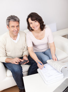 Mature couple doing family finances