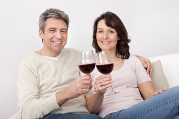 Mature couple drinking red wine