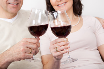Mature couple drinking red wine