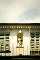 Fototapeten Virgin Mary in a facade building © vali_111