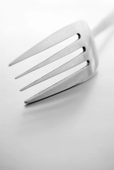 Fork on a gray background and a place for your text