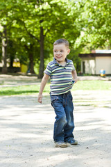 Fototapeta premium Happy kid playing in street