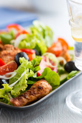 Chicken Salad (glass of water with lemon in the foreground)