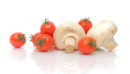 cherry tomatoes and mushrooms on a white background
