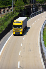 Yellow heavy transportation on highway
