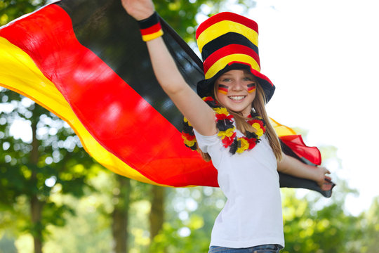 german soccer fan waving her flag