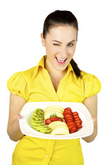 Blinking girl with fresh fruit