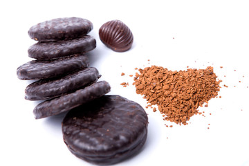 Instant coffee in the form of heart, a chocolate and cookies on