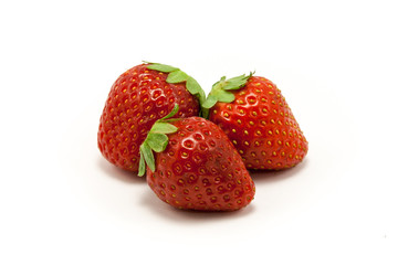 Three juicy strawberries on white background