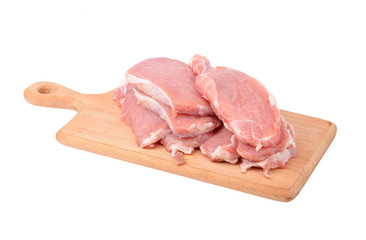 Raw meat steaks on wooden board, isolated on white background