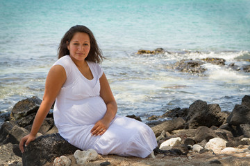 Fototapeta na wymiar Young Mother To Be at the Tropical Seashore of Hawaii