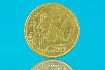 Fifty euro cent on blue background