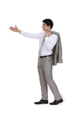 Casual businessman holding out arm