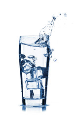 water splash in glass isolated on white