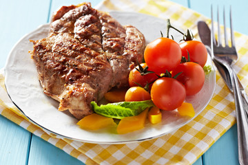 Gourmet grilled pork steak with vegetables