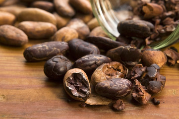 Cocoa (cacao) beans on natural wooden table