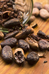 Cocoa (cacao) beans on natural wooden table