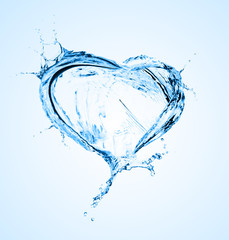 Fototapeta na wymiar Heart from water splash with bubbles isolated on white