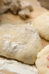 Dough on wooden board