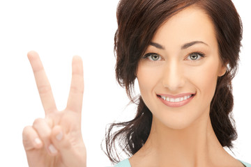 young woman showing victory sign