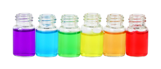 Row of six small bottles of different colored aromatic oils