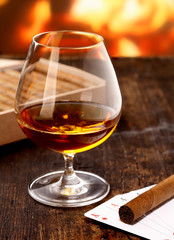 Cognac warming in front of the fire
