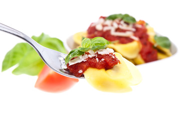 Tortellini on a fork with blurred portion