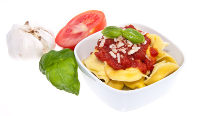 Tortellini in a bowl isolated on white