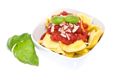 Tortellini in a bowl isolated on white