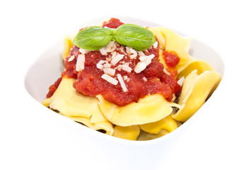 Tortellini in a bowl isolated on white