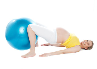 Fototapeta na wymiar Pregnant woman doing relaxation exercise